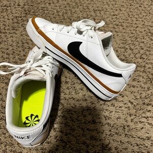 Nike White and Black Sneakers with Gold Accents